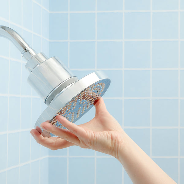 A Hydroviv user attaching their Filtered Showerhead to a shower pipe.