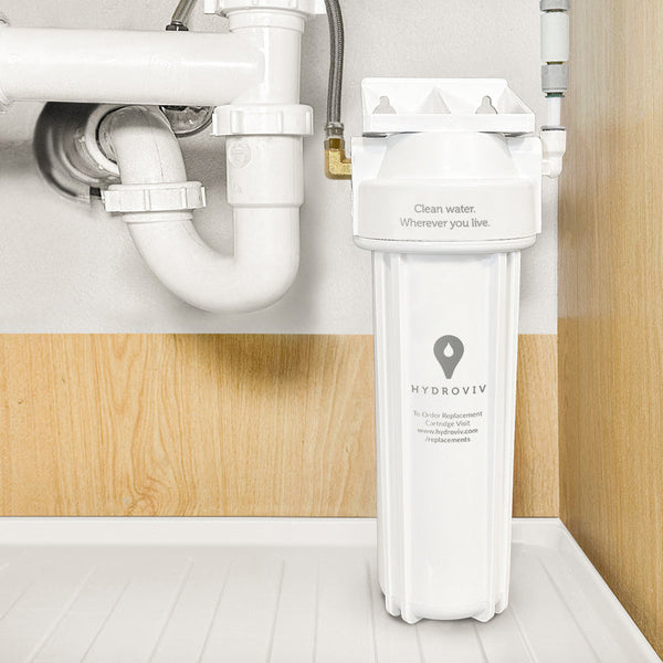 The Hydroviv Under Sink Water Filter installed under a kitchen sink.