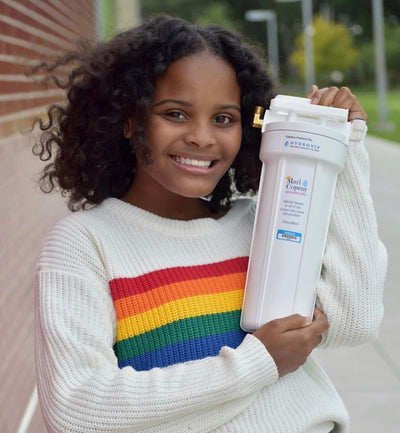 Image of Little Miss Flint holding a Hydroviv water filter