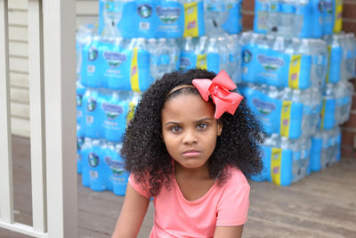 Mari Copenny or Little Miss Flint with bottled water in background
