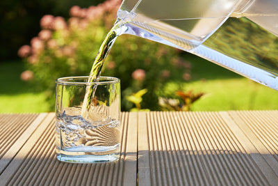 Pristine water pouring into cup