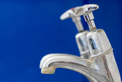Water faucet with crusted limescale