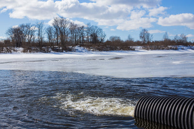 water pipe discharging effluent into lake