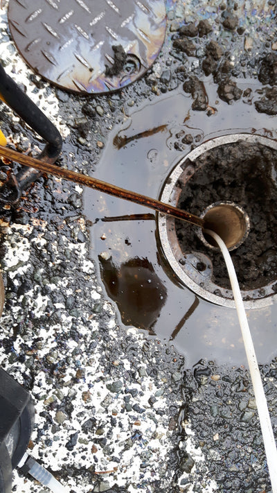 Polluted well with pipes going into groundwater