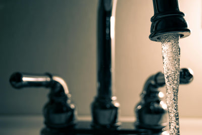 A faucet with water running