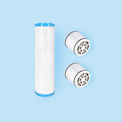 Photo of a replacement filter for the Hydroviv faucet filter and two replacement filters for the Hydroviv filtered showerhead on a blue background.