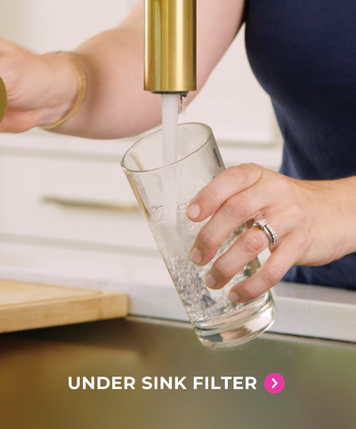 Person filling water glass